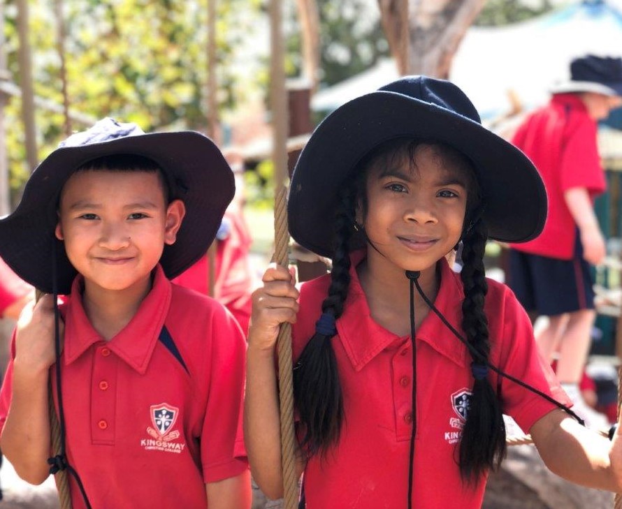 Primary school students playing outdoors on the nature playground