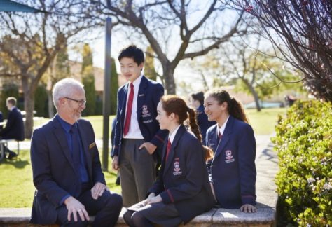 Kingsway Christian College Principal outdoors talking with high school students