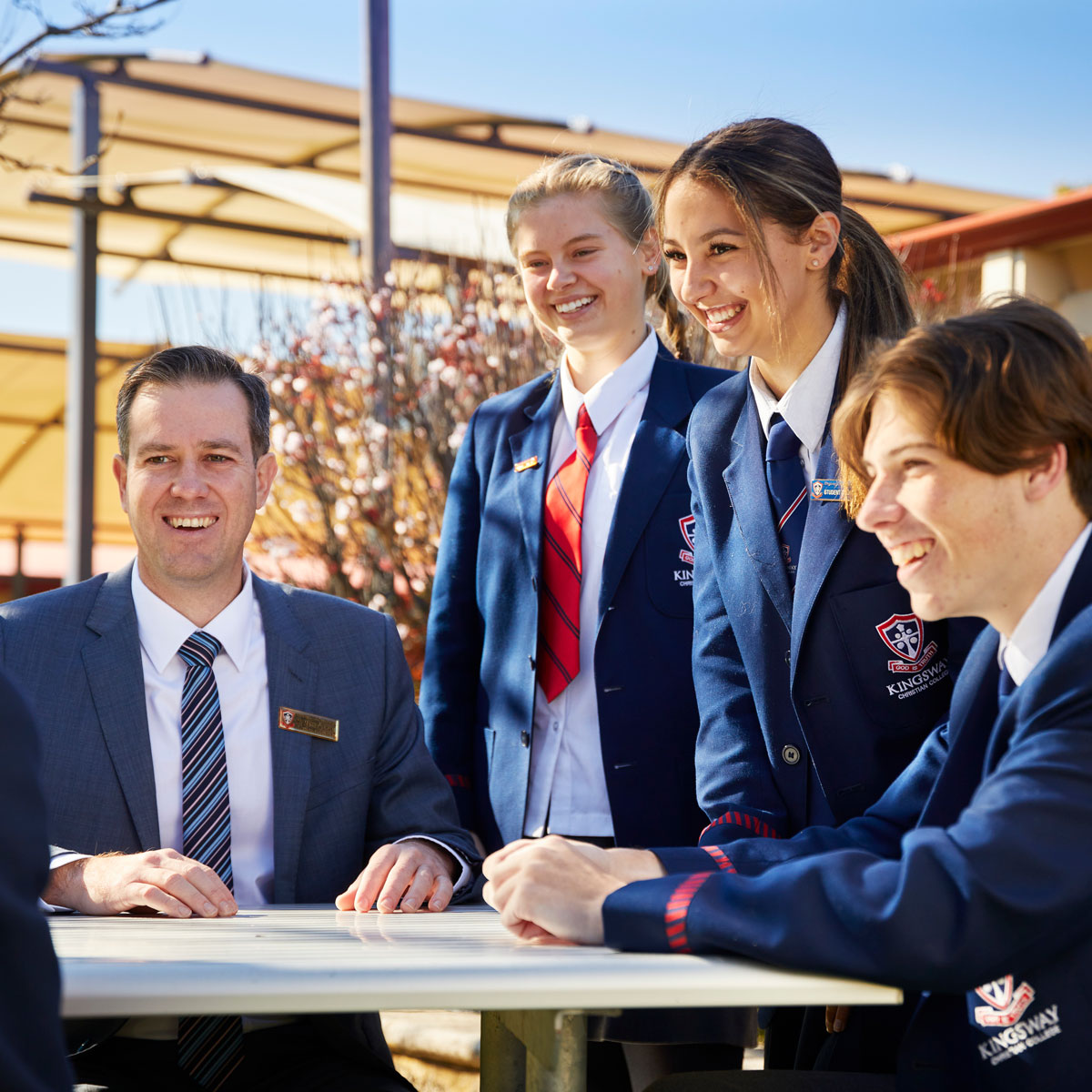 Kingsway teacher laughing with secondary school students