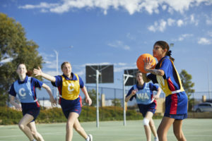 High School students playing netball outside at Kingsway Christian College