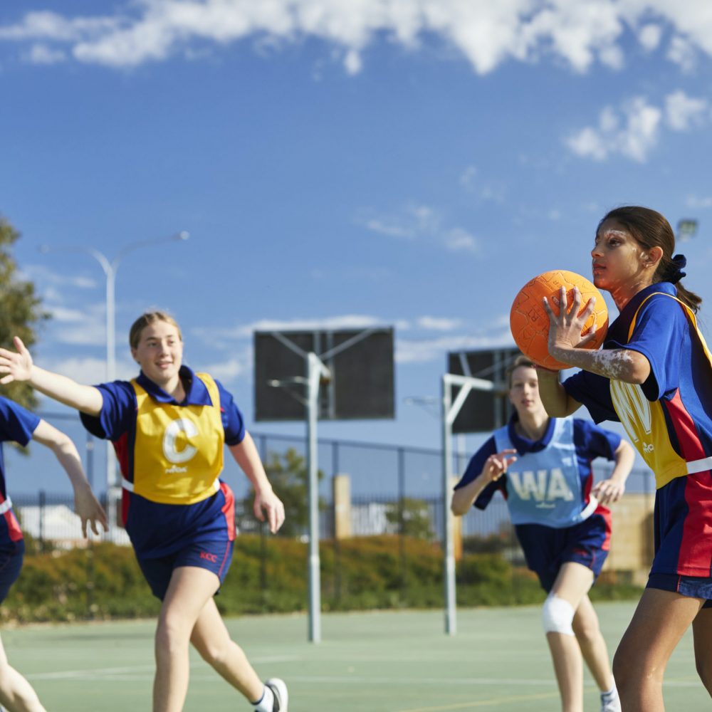 High School students playing netball outside at Kingsway Christian College